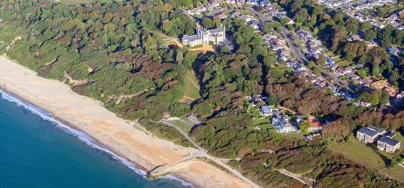 Arial view of Highcliffe beach with the castle sat in the background