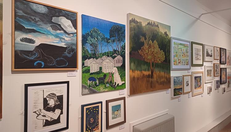 Paintings hung in an exhibition