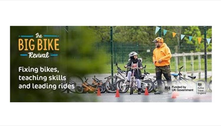 Big Bike Revival Poster with a man helping a little boy fix his bike