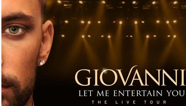 half front profile of Giovanni Pernice's face with stage lights in the background