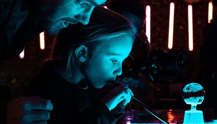 Father and daughter enjoying bubble workshop