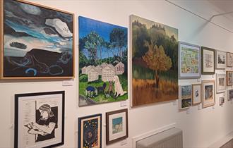 Paintings hung in an exhibition
