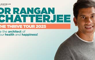 Dr Rangan Chatterjee in a grey top smiling at the camera